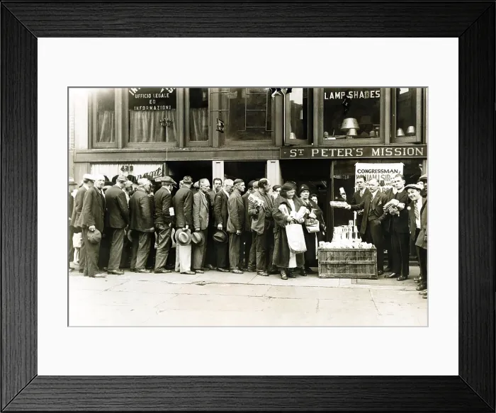 Framed Print : Breadline for the needy in New York City. Representative Peter Sirovich (left) and Father William Normen distribute loaves of bread at St. Peter's Mission. Ca. Oct. 28, 1930