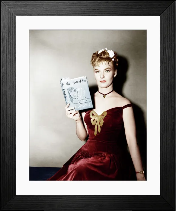 Framed Print : THE THREE FACES OF EVE, Joanne Woodward holding a copy of the bestseller, 1957. 20th Century-Fox FIlm Corporation, TM & Copyright / courtesy Everett Collection Framed Print : THE THREE FACES OF EVE, Joanne Woodward holding a copy of the bestseller, 1957. 20th Century-Fox FIlm Corporation, TM & Copyright / courtesy Everett Collection