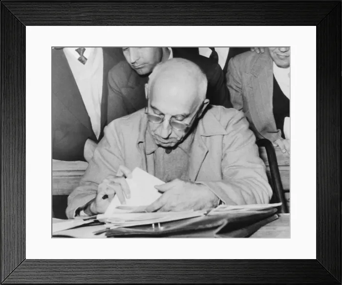 Framed Print : Ousted Iranian Premier Mohammed Mossadegh reads during his Teheran treason trial. Dec. 19, 1953 Framed Print : Ousted Iranian Premier Mohammed Mossadegh reads during his Teheran treason trial. Dec. 19, 1953