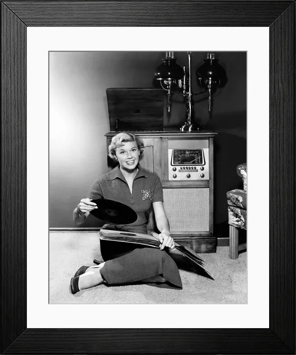 Framed Print : Doris Day, enjoying her record collection, ca. 1950 Framed Print : Doris Day, enjoying her record collection, ca. 1950