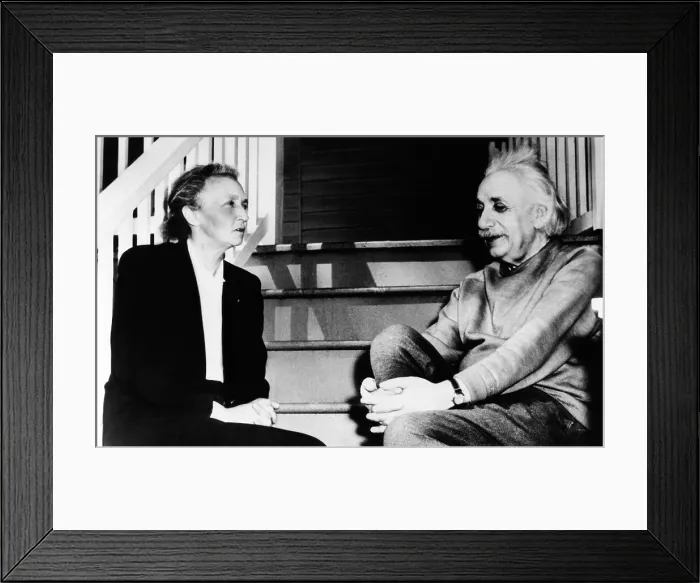 Framed Print : Madame Joliot-Curie and Albert Einstein. The two Nobel Prize winning physicists talk on the steps of Einstein's home in Princeton. March 1948