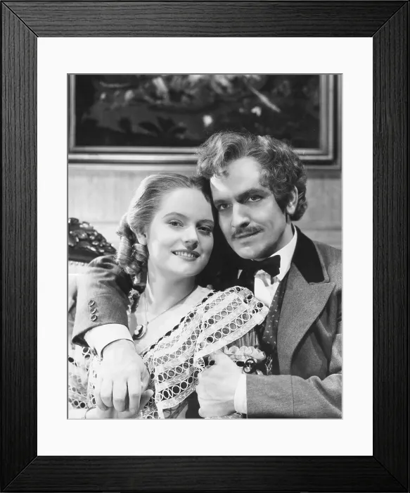 Framed Print : THE ADVENTURES OF MARK TWAIN, from left, Alexis Smith, Fredric March, 1944