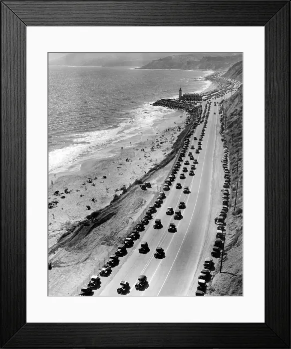 Framed Print : Start of the beach season. Thousands of cars drive on Roosevelt highway north from Santa Monica. Many are parked along the base of the mountains on the scenic Malibu coast Framed Print : Start of the beach season. Thousands of cars drive on Roosevelt highway north from Santa Monica. Many are parked along the base of the mountains on the scenic Malibu coast