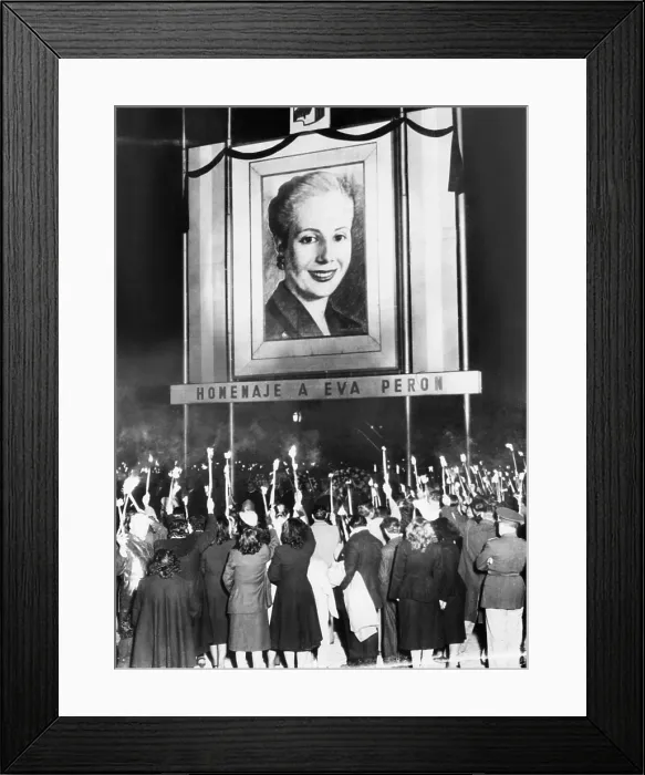 Framed Print : Honor Eva Peron. Argentines mourning the death of Eva Peron beneath a huge portrait of the deceased wife of their nation's President, Juan Peron Framed Print : Honor Eva Peron. Argentines mourning the death of Eva Peron beneath a huge portrait of the deceased wife of their nation's President, Juan Peron