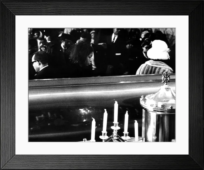 Framed Print : Funeral of Malcolm X. Betty Little Shabazz, widow of slain African American Black Muslim leader Malcolm X, walks away from her husbands coffin funeral services. February 27, 1965