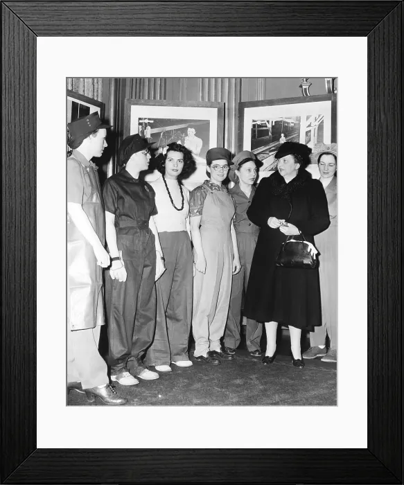 Framed Print : Secretary of Labor Frances Perkins examines work clothes for women. March 1, 1943. The work clothes for women were designed to promote safety and efficiency Framed Print : Secretary of Labor Frances Perkins examines work clothes for women. March 1, 1943. The work clothes for women were designed to promote safety and efficiency