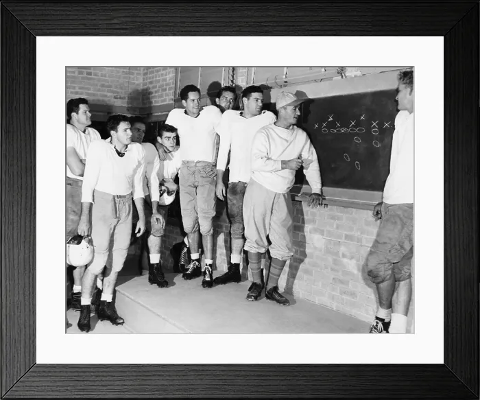 Framed Print : Coach Blair Cherry diagrams plays for the Texas University football team. Dec. 15, 1947. At far right is the stellar back, Bobby Layne Framed Print : Coach Blair Cherry diagrams plays for the Texas University football team. Dec. 15, 1947. At far right is the stellar back, Bobby Layne