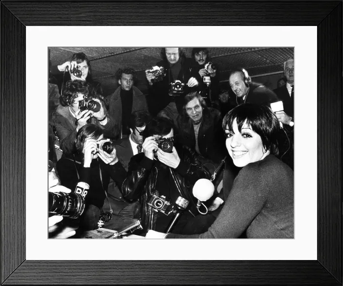 Framed Print : Liza Minnelli is surrounded by photographers during an airport news conference in Paris. Jan. 17, 1975. (CSU_2015_11_1609) Framed Print : Liza Minnelli is surrounded by photographers during an airport news conference in Paris. Jan. 17, 1975. (CSU_2015_11_1609)
