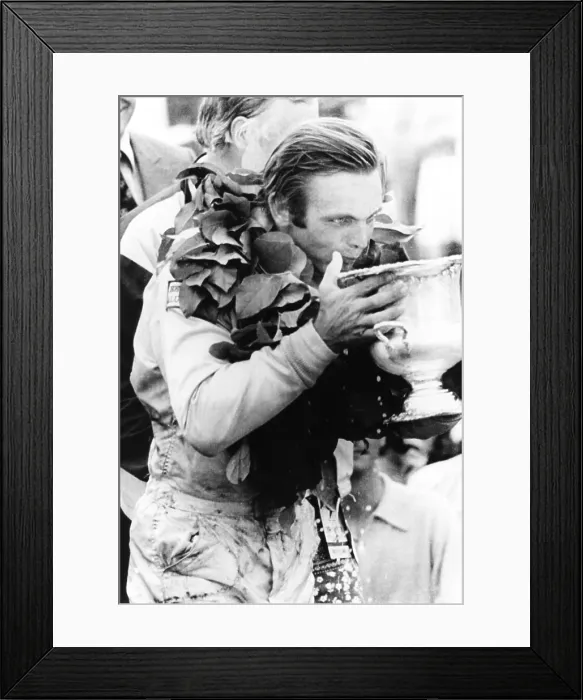 Framed Print : Peter Revson drinks from his trophy after winning the Canadian-American championship. Watkins Glenn, NY, July 25, 1971. He averaged a speed of 128.58 mph
