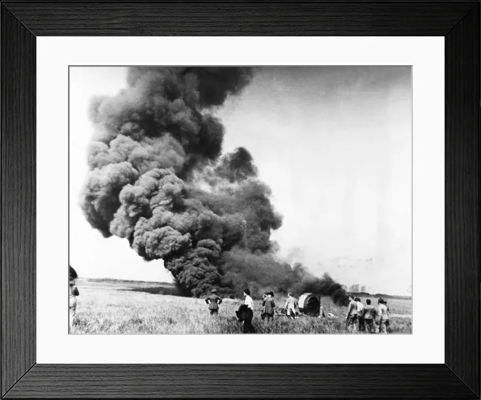 Framed Print : Auguste Piccard's balloon disappearing in smoke and flame, May 31, 1937. In the foreground is the basket