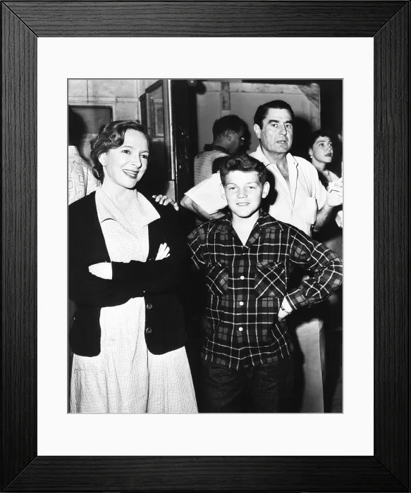 Framed Print : Helen Hayes, America's first actress, shows her son, Jamie MacArthur, around the Paramount set. July 1952. She was filming MY SON JOHN, directed by Leo McCaroy (right)