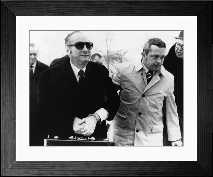 Framed Print : Bobby Baker in hand cuffs is escorted by U.S. Marshals into Lewisburg Penitentiary, Jan. 14, 1971. He serving 18 months in prison for fraud, theft, and income tax evasion Framed Print : Bobby Baker in hand cuffs is escorted by U.S. Marshals into Lewisburg Penitentiary, Jan. 14, 1971. He serving 18 months in prison for fraud, theft, and income tax evasion