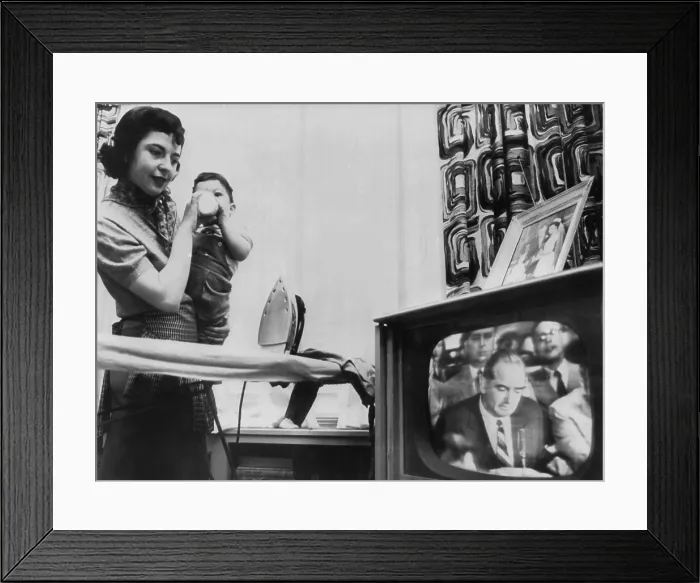 Framed Print : A New York City mother watches a televised Army McCarthy Hearing