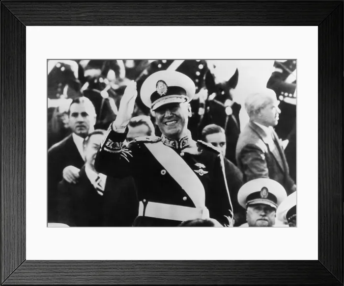 Framed Print : Juan Peron, newly elected President of Argentina waves to crowds from inaugural parade. Peron wears the uniform of a Brigadier General