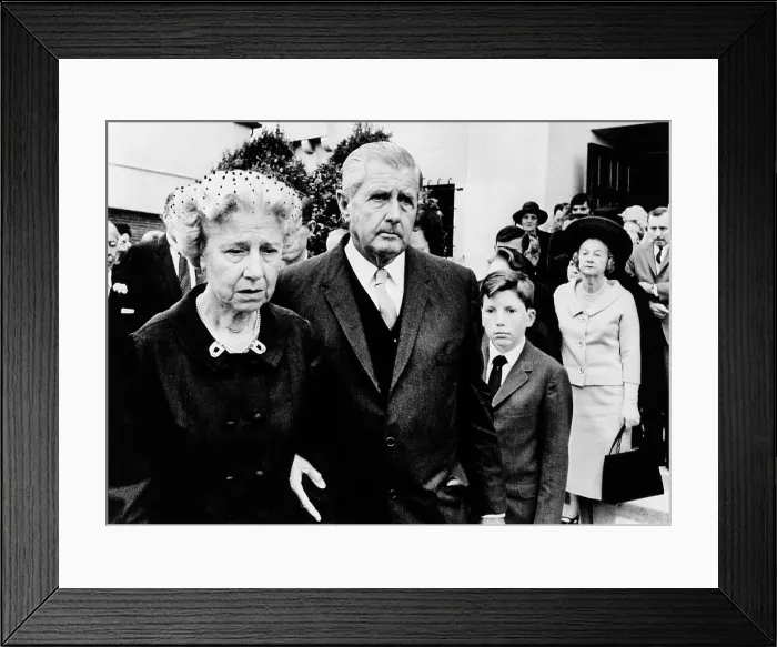 Framed Print : Spencer Tracy's widow, Louise, leaving Requiem Mass for her estranged husband. She is escorted by MGM Executive Howard Striekling. At right is Tracy's grandson, John, Jr