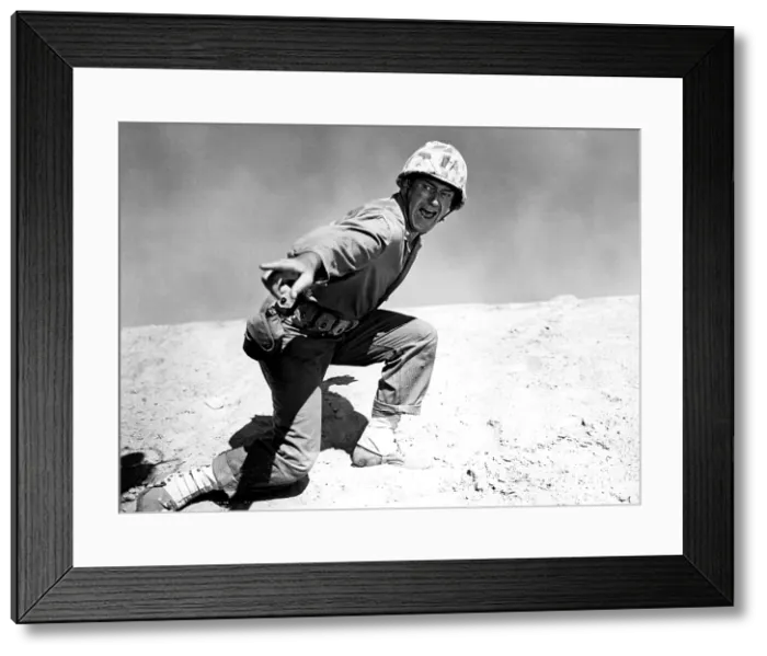 Framed Print : SANDS OF IWO JIMA, John Wayne, 1949, barking orders in battle