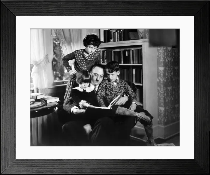 Framed Print : Dr. Karl A. Menninger, psychiatrist, with his children. Ca. 1930. They are playing anagrams. Julia is standing, while Martha and Robert sit with their father. (CSU_2015_11_1627)