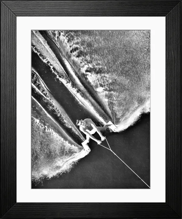 Framed Print : Water skier George Hughes passed under the bridge at Cypress Gardens, Florida. June 28, 1963. He wore only tiny shoe skis instead of the traditional long water skis Framed Print : Water skier George Hughes passed under the bridge at Cypress Gardens, Florida. June 28, 1963. He wore only tiny shoe skis instead of the traditional long water skis