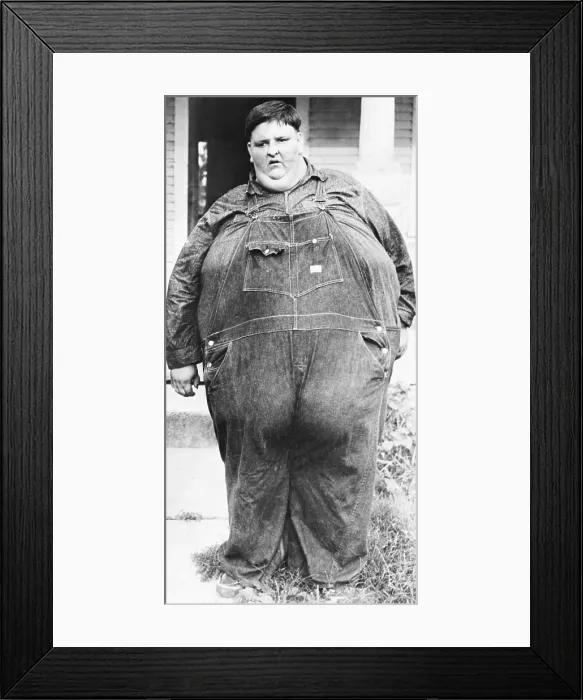 Framed Print : Robert Hughes, 18 years old, weighed of 708 pounds at his draft physical on June 9, 1944. His 95 inch waistline kept him out of the Army