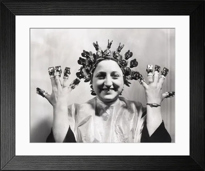 Framed Print : Model wears Helene Curtis remote control permanent wave. March 13, 1940. She wears nail shields invented by David of Wilshire to protect her freshly polished nails
