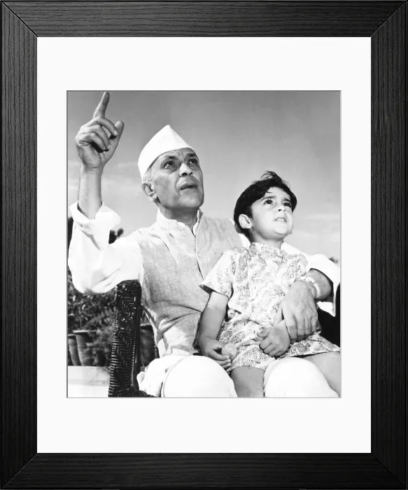 Framed Print : Jawaharlal Nehru, Premier of India, is shown talking with his 3-year-old grandson, Rajiva Gandhi. Rajiva became the 7th Prime Minister of India, from 1984 to 1989