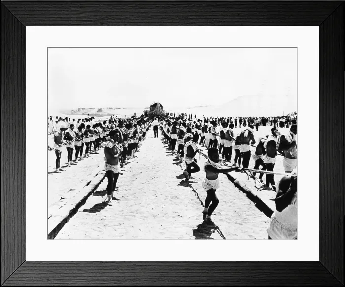 Framed Print : 500 costumed Cairo students drag the 10 ton papyrus raft RA along wooden planks