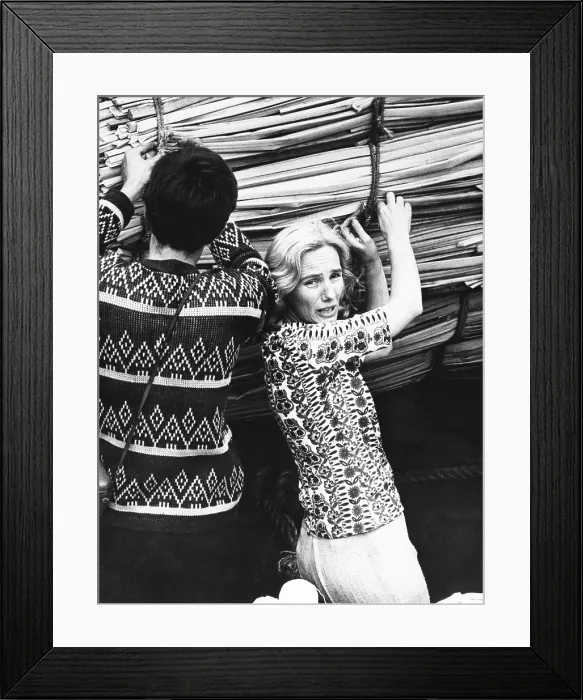 Framed Print : Yvonne Heyerdahl, wife of expedition leader, helps with final detail before the RA was launched