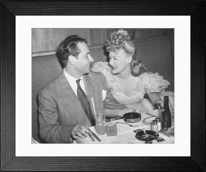 Framed Print : Movie star Betty Hutton with her fiance, newscaster, in Charles Martin at the Stock Club. New York City, Sept. 2, 1943. They never wed, instead she married Ted Briskin on Sept