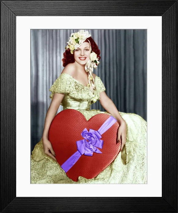 Framed Print : Rita Hayworth poses with a giant heart, ca. 1930s