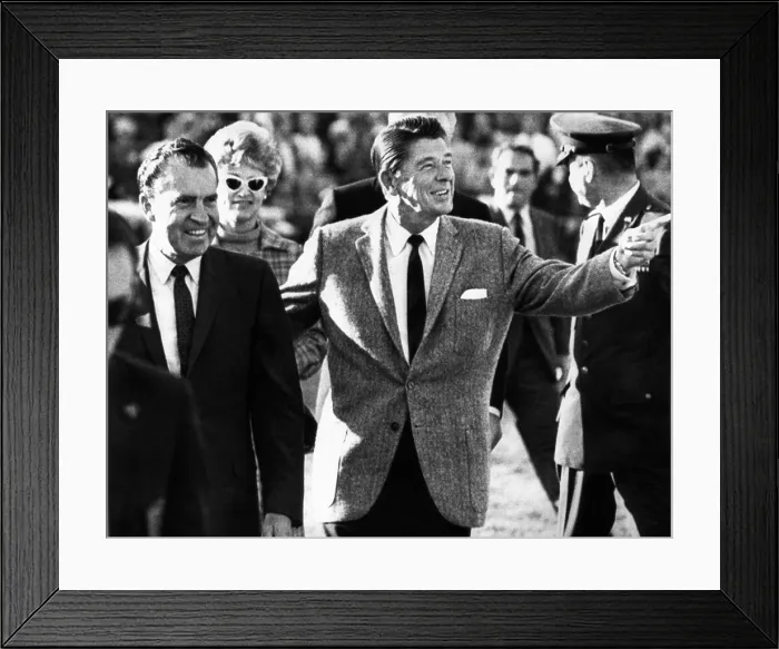 Framed Print : Calif. Governor Ronald Reagan escorts President-elect Richard Nixon across the field at half time of the Rose Bowl game