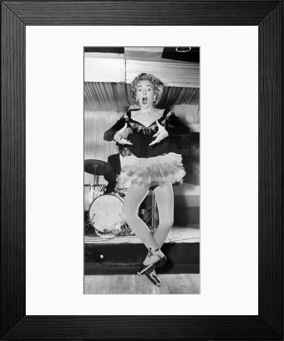 Framed Print : Christine Jorgensen in one of her acts at the Caf Society Club in Greenwich Village, May 2, 1956