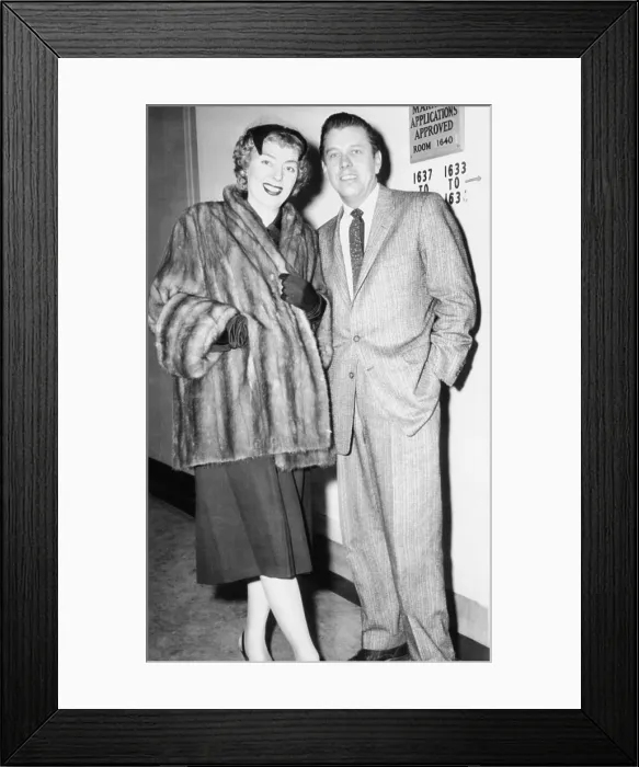 Framed Print : Christine Jorgensen, 33-year-old transsexual, with boyfriend, Howard J. Knox, 39, March 31, 1955. They applied for a marriage license in NYC, but were refused
