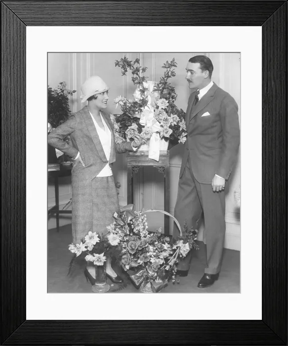 Framed Print : Newly married Gloria Swanson and Marquis de la Falaise, at the Ritz Carlton Hotel in New York City. Many floral pieces greeted her return from France in Nov. 1923 Framed Print : Newly married Gloria Swanson and Marquis de la Falaise, at the Ritz Carlton Hotel in New York City. Many floral pieces greeted her return from France in Nov. 1923