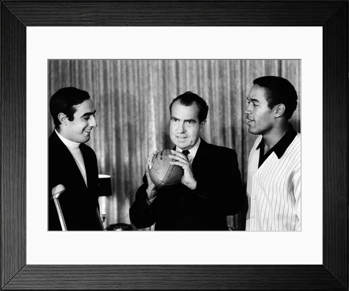 Framed Print : President-elect Richard Nixon was visited by All-Americans. L-R: Notre Dame quarterback Terry Hanratty, Nixon, USC running back O.J. Simpson. Dec. 2, 1968