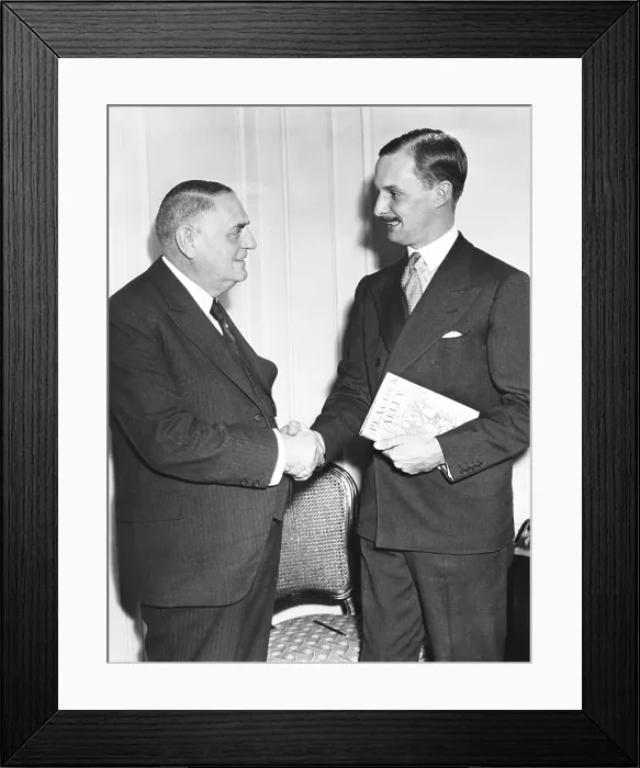 Framed Print : Waldorf Astor (right), grandson of William Waldorf Astor in New York, Oct 23, 1933. He is welcomed to the Waldorf Astoria Hotel by Oscar Tschirky, famous matre d'of the hotel