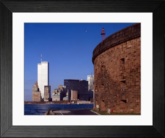 Framed Print : New York City, view of lower Manhattan and the World Trade Center from Governor's Island, Castle Williams is on the right; 1982-1983 Framed Print : New York City, view of lower Manhattan and the World Trade Center from Governor's Island, Castle Williams is on the right; 1982-1983