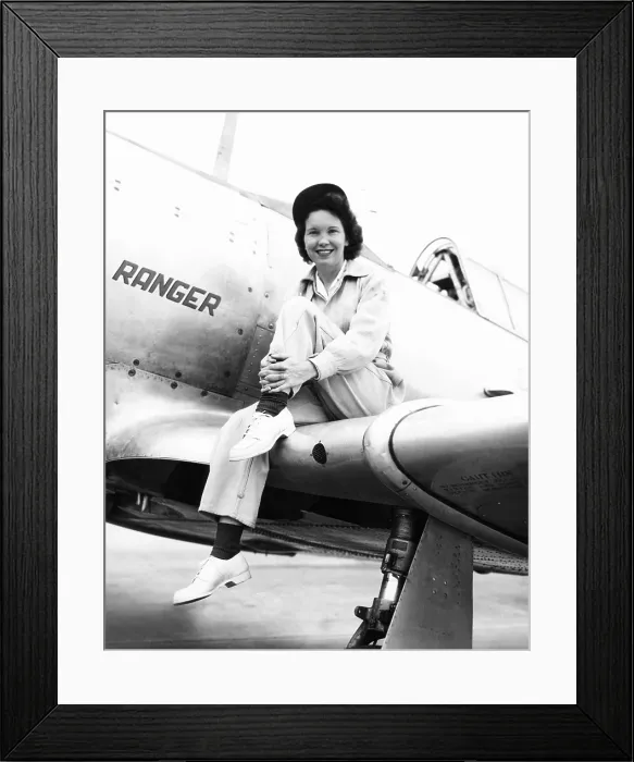 Framed Print : Margaret (Mickey) McGrath, former WASP sitting on the wing of in an XAT-6E trainer aircraft. It was equipped with an experimental Ranger Engine