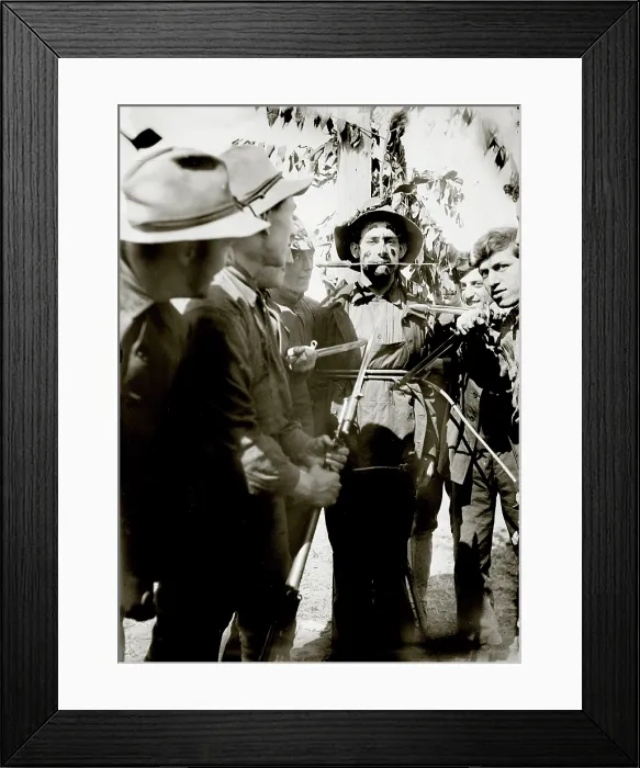 Framed Print : World War I, soldiers haze a new militiaman with knives at Fort Wadsworth military base, Staten Island New York, circa 1908