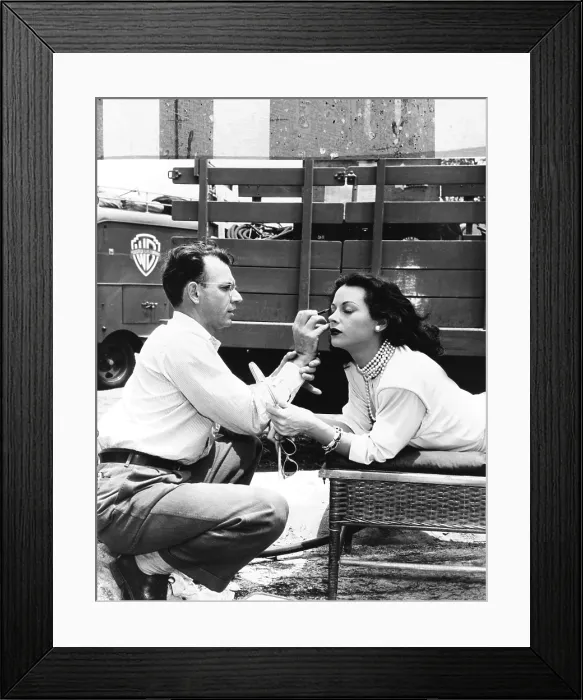 Framed Print : Makeup artist Ben Nye applying eye makeup to actress Hedy Lamarr who observes in a mirror. Ca. 1940s. (CSU_2015_8_485) Framed Print : Makeup artist Ben Nye applying eye makeup to actress Hedy Lamarr who observes in a mirror. Ca. 1940s. (CSU_2015_8_485)