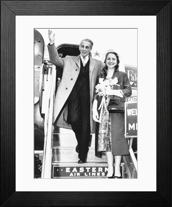 Framed Print : Clifton Daniel, Jr. waves to crowd gathered at Miami to see his new bride, former Margaret Truman. The couple were enroute to honeymoon in Nassau, Bahamas