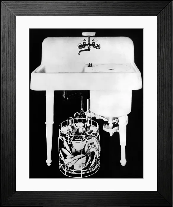 Framed Print : 1920s Electric Dishwashersink. It had a heavy, enameled, cast-iron tub attached to a sink by U bolts and a rubber gasket Framed Print : 1920s Electric Dishwashersink. It had a heavy, enameled, cast-iron tub attached to a sink by U bolts and a rubber gasket