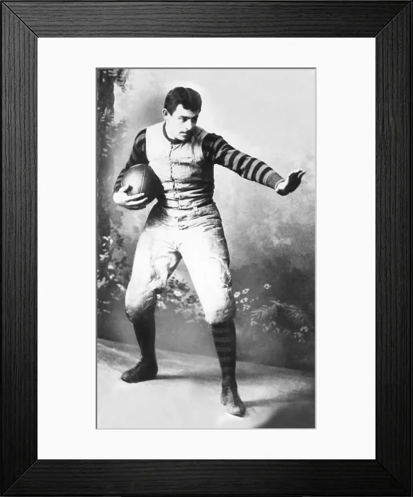 Framed Print : John Heisman in his University of Pennsylvania football uniform, ca. 1891. He played football at Brown Univ. 1887-89, and at the Univ. of Pennsylvania 1890-91 Framed Print : John Heisman in his University of Pennsylvania football uniform, ca. 1891. He played football at Brown Univ. 1887-89, and at the Univ. of Pennsylvania 1890-91