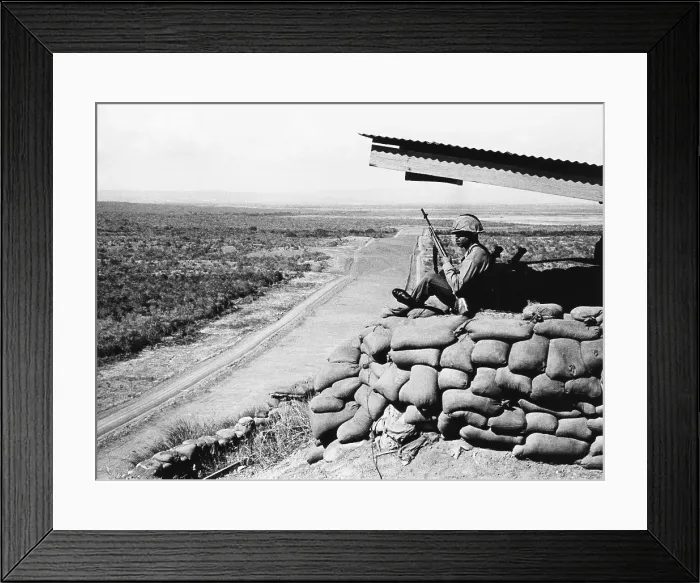 Framed Print : U.S. Marine, looks across into Communist Cuba from Guantanamo Naval Base Cuba. Feb. 16, 1964. The U.S