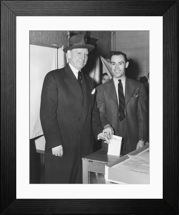 Framed Print : Jersey City Mayor Frank Hagen (left) casting his vote in the general election on Nov. 5, 1941. He was a powerful, entrenched, old style city boss and was Mayor from 1917 to 1947