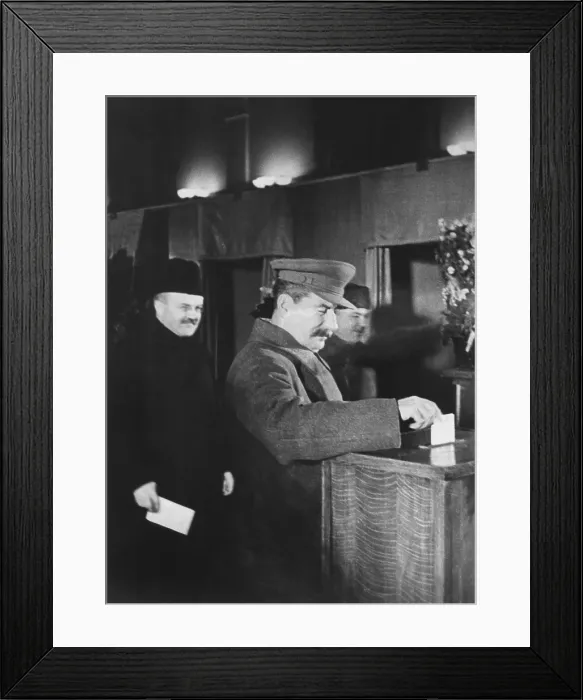 Framed Print : Josef Stalin, voting at an election for members of the Supreme Soviet. Ca. 1940. Behind Stalin is V