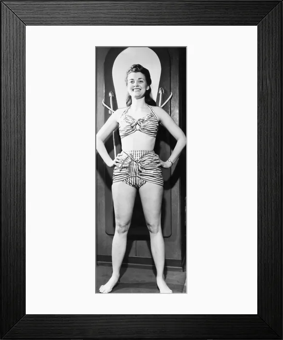 Framed Print : Model in a 1946 striped glazed cotton chintz bathing suit. It was exhibited at the International Sportsman's Show at Chicago Coliseum, February 22, 1946. (CSU_2015_9_827)
