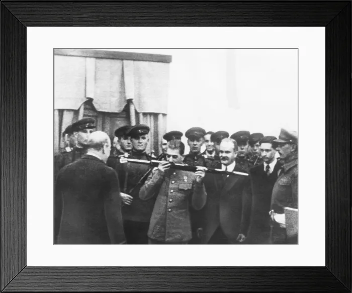 Framed Print : Josef Stalin kisses sword given by British in honor of the citizens of Stalingrad. Dec. 7, 1943. Winston Churchill (back to camera), made the presentation