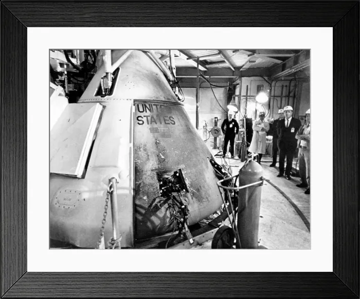 Framed Print : Technicians viewing the Apollo spacecraft where three flight crew members died during a launch simulation test, Cape Canaveral, Florida, 1967