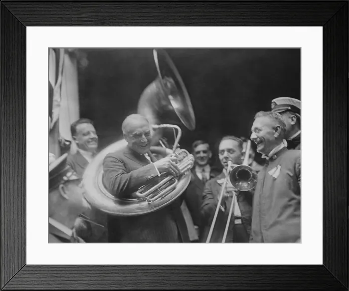 Framed Print : Republican Presidential nominee Warren Harding encircled by a sousaphone. August 1920. This created an amusing image for his front porch campaign in 1920