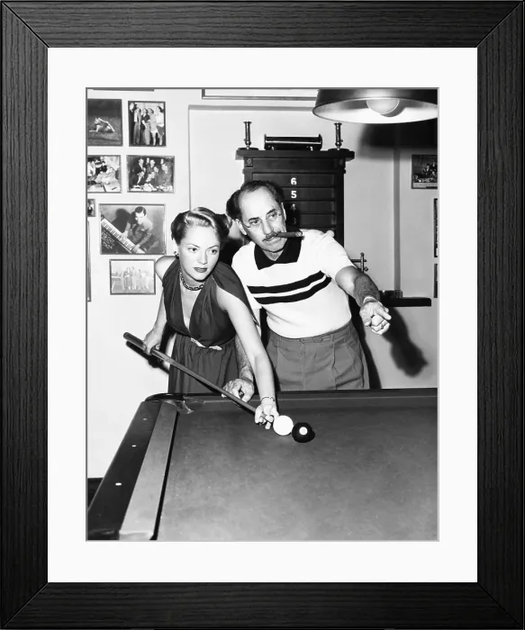 Framed Print : Groucho Marx at home playing billiards with his young wife, Actress Kay Maris in 1949. Her first husband was Actor Leo Gorcey, whom she married when she was 17. (CSU_2015_11_1481)